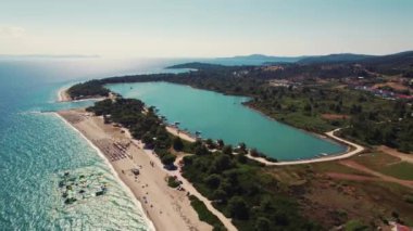 birds-eye view of Glarokavos Beach and port in Kassandra peninsula, Halkidiki, Greece. High quality 4k footage