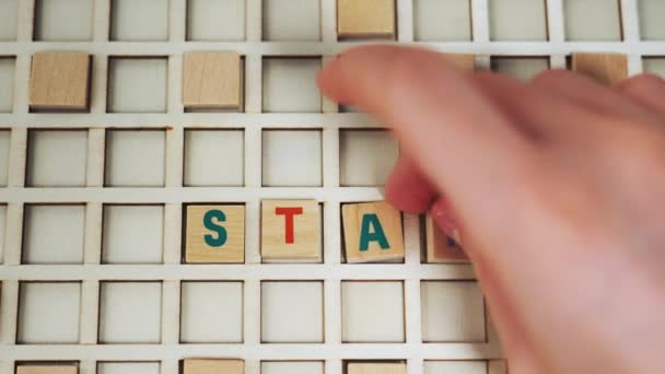 Colourful Wooden Square Letters Creating Word Start Advertisement Idea Orange — Vídeo de Stock