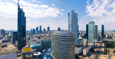 7.22.2022 Warsaw, Poland. Varso Tower, Zlota 44, and other skyscrapers creating neomodern cityscape of European city. Panoramic aerial shot. Sunny weather, blue sky. High quality photo