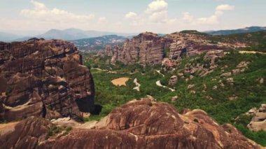 Thessaly, Meteora Monasteries, the town of Kalabaka in central Greece. Panoramic aerial view of rock formations and incredible nature. High quality 4k footage