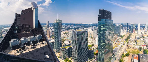 7.22.2022 Warsaw, Poland. Characteristic elements of Warsaw skyline. Skyliner and Warsaw Unit - two neomodern elegant office buildings seen from the top. High quality photo