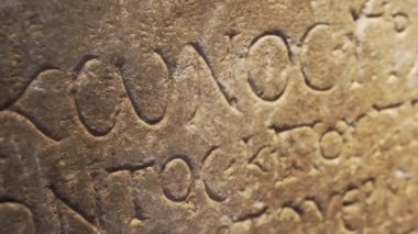 Ancient Greek manuscript engraved in stone. Inscription in ancient Greek. High quality 4k footage