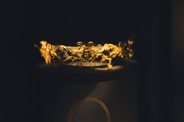 07.13.2022 Thessaloniki, Greece. Archaeological Museum of Thessaloniki. Beautiful golden ornament. Dark background. High quality photo