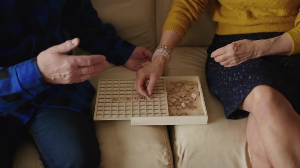 Old Caucasian Man Woman Playing Board Game Building Words Board — Vídeos de Stock