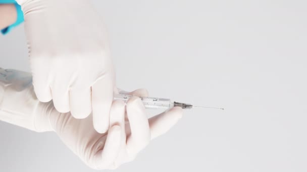 Vertical Shot Two Hands White Protective Gloves Preparing Syringe Vaccine — Stok Video