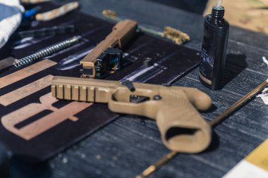08.07.2022 Warsaw, Poland. Sig Sauer P320 full size. Unusual beige gun. Gunsmith concept. Taking care of firearm. High quality photo