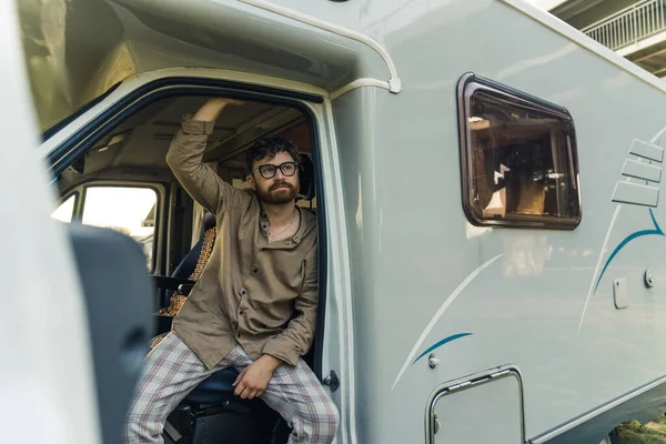 Thoughtful Stylish Young Bearded Man Sitting Driver Seat Camper Van — 스톡 사진