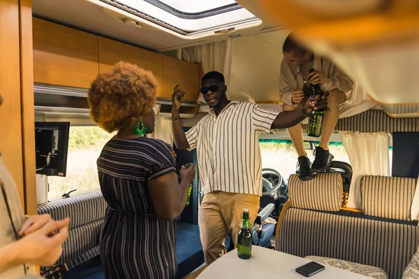 lets dance, friends - Caucasian and Afro-American friends enjoying in the van. High quality photo