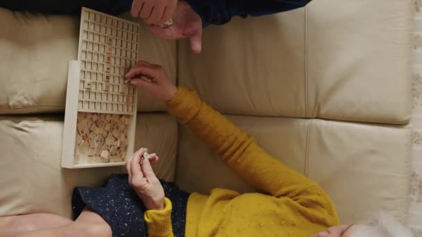 Senior European Married Couple Playing Board Game Building Words Board — 비디오