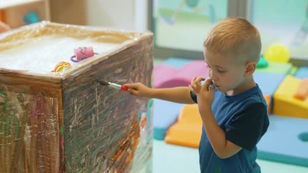 Caucasian Little Boy Painting His Teacher Kindergarten High Quality Footage — Stock Video