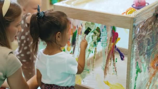 Cute Little Girl Painting Glass Kindergarten High Quality Footage — Stock video