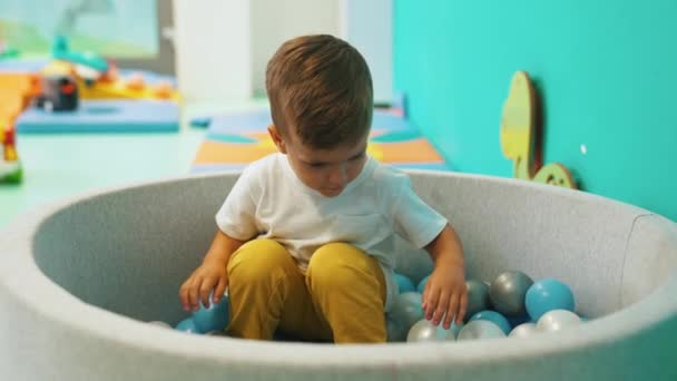 Very Cute Boy Lovely Smile Sitting Balls Playroom Kindergarten High — Vídeos de Stock