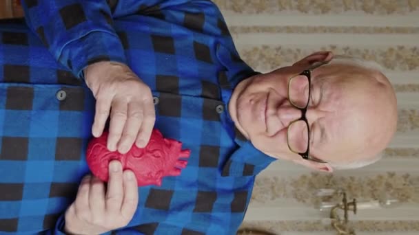 European Senior Man Holding Artificial Fake Heart Prop Front His — Stok Video
