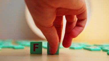 The FAQ made of small colorful cube letters. . High quality 4k footage