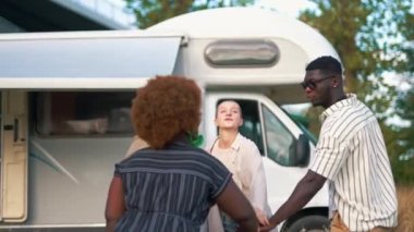 Multicultural group of young people standing in circle and holding their hands on top of each other. Unity, teamwork and support concept. High quality 4k footage