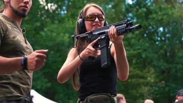 Shooting Range Concept Skinny Long Haired Caucasian Woman Black Tank — Stock videók