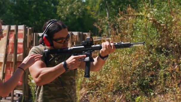 White Woman Man Wearing Safety Gear Outdoor Shooting Range Practicing — Stock video