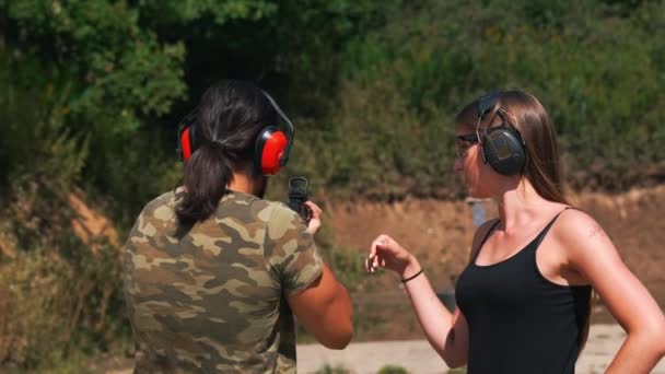 White Woman Man Wearing Safety Gear Outdoor Shooting Range Practicing — Stock video