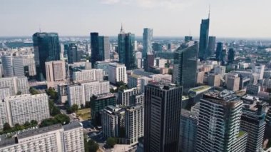 Drone view of tall apartment buildings and skyscrapers in the center of Warsaw Poland. Modern cityscape in the day. Horizontal. High quality 4k footage