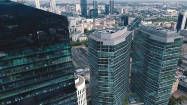 Drone shot of glass skyscrapers in residential areas of Warsaw Poland. City center landscape in daytime. Horizontal. High quality 4k footage