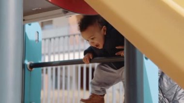 mom, help me. little boy with his mom at the playground. High quality 4k footage