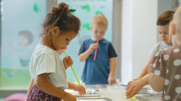 Multi Ethnic Group Toddlers Milk Painting Teacher Helping Them Using — Αρχείο Βίντεο