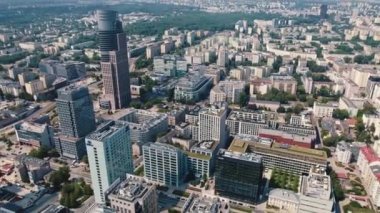Drone view of residential and business area of Warsaw Poland with apartment buildings modern high-rises and trees. Horizontal. High quality 4k footage