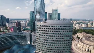 Drone shot of the center of Warsaw Poland with skyscrapers parts of Zlote Tarasy shopping center and Palace of Culture and Science with residential areas in the background. Horizontal . High quality
