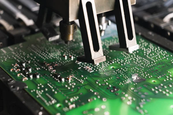 Tiny elecrtical components mounted onto PCB printed circuit board by surface-mount device SMD. Modern technology. Horizontal close-up shot. High quality photo