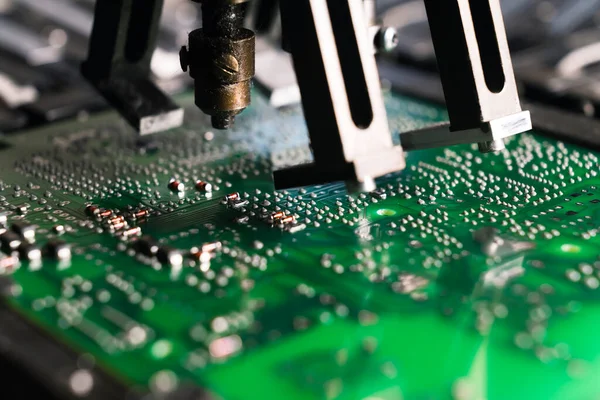 Close-up shot of printed circuit board PCB with electrical components mounted by SMD surface-mount device. Precision technology. Horizontal. High quality photo