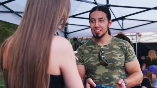 Caucasian Muscular Man Wearing Camo Shirt Presenting Handgun Female Client — Stock Video