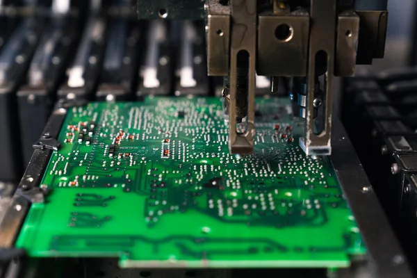 Mechanical montage of surface-mount technology. PCB electrically connecting electronic components with the use of conductive pathways. High quality photo