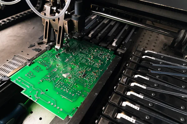Close up of SFD surface-mount device working on PCB printed circuit board. Assembling. Modern technology. High quality photo