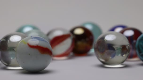 Glass Marble Balls Playing Rolling Hitting Clashing White Background — Vídeos de Stock