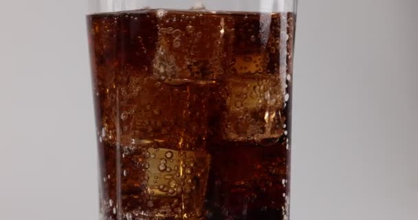 Pouring Dark Soda Drink Tall Glass Ice Cube Bubble Fizz — Stock Video