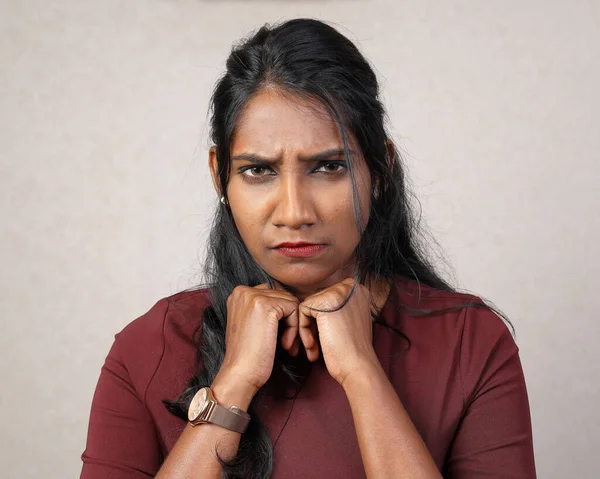 Asian Indian origin dark skin tone beautiful woman facial hand expression surprised grumpy angry hand on cheek