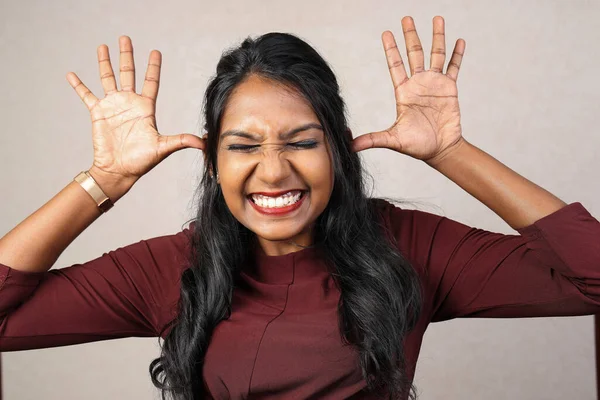 Asian Indian origin dark skin tone beautiful woman facial hand expression making faces hand signs funny