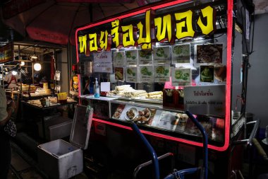 Bangkok, Thailand-July 28. 2022- Famous Bangkok Chinatown tourists visitors go to place for Micheline star award variety street food, neon light lit signs   