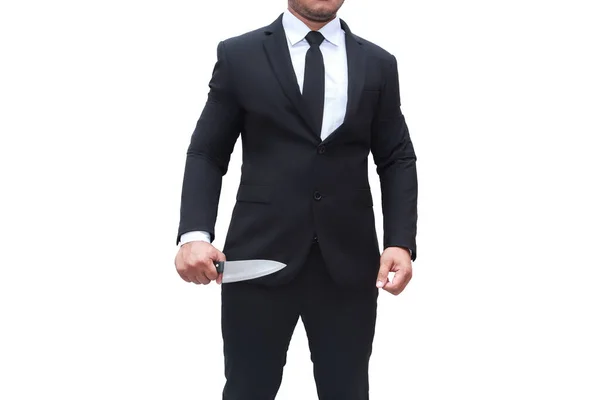 黒のスーツを着た実業家が白い背景にナイフで立っている — ストック写真