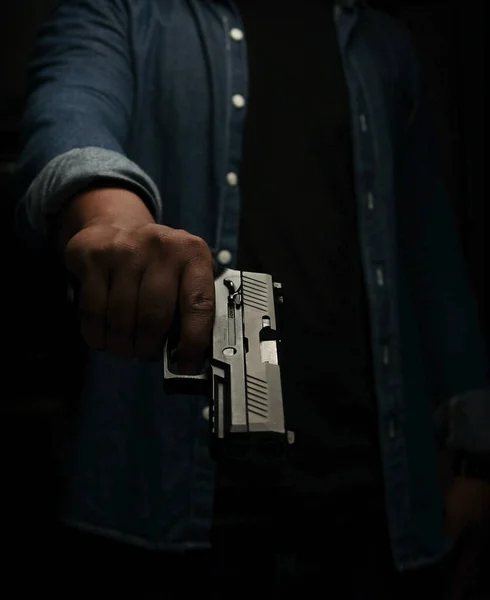 Man Blue Denim Shirt Standing Dark Room Pistol Point Aim — Stock Photo, Image