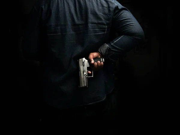 Man Blue Denim Shirt Standing Dark Room Pistol Him Concept — Stock Photo, Image