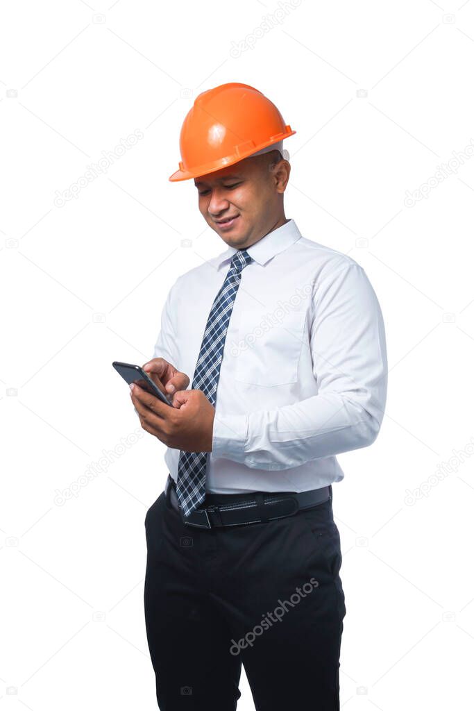 Young engineer or architect playing on phone and smiling happy isolated on white background with clipping path