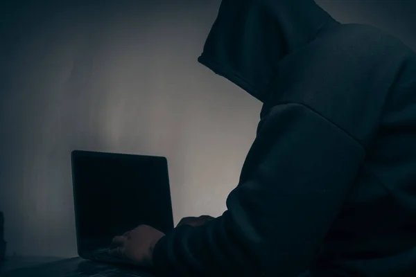 Hacker Wears Long Sleeved Shirt Hood Covering His Head Sitting — Φωτογραφία Αρχείου