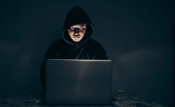 Hacker Wears Long Sleeved Shirt Hood Covering His Head Sitting — Stockfoto