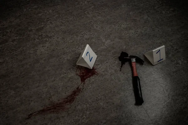 The blood of the victim's hammer is the murderer's weapon.Crime scene investigation with copy space.