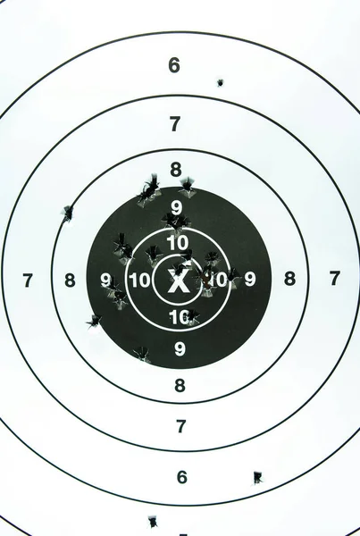 Target shooting practice with bullet holes. close-up