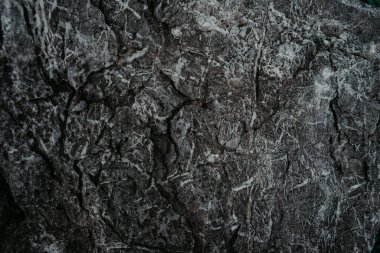 Koyu taş ya da kaya dokusu arkaplanının üst görüntüsü. yüksek çözünürlüklü duvar tasarımı dokusu