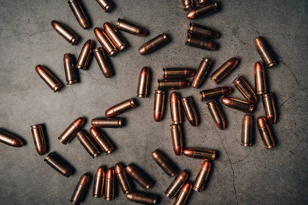 9mm ammunition on an old plaster background
