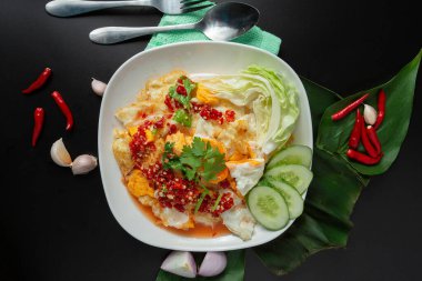 Spicy and hot fried egg salad. Thai style. Thai street food.