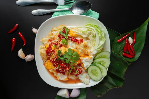 Spicy and hot fried egg salad. Thai style. Thai street food.